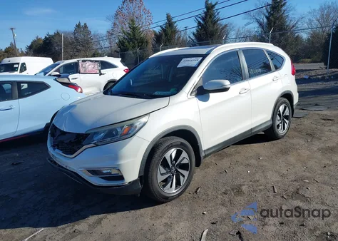 2016 Honda Cr-V Touring z USA, uszkodzony, nr VIN 5J6RM4H91GL034943